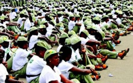 nysc members sitting in camp